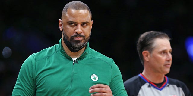 Celtics head coach Ime Udoka (left) did not agree with a referee (right) in the second quarter of a game against the Golden State Warriors June 17, 2022. 