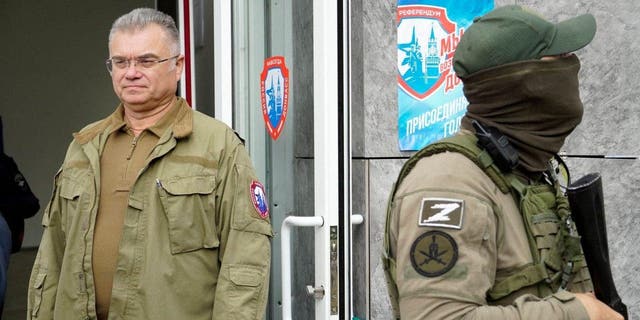 Konstantin Ivashchenko (L), former CEO of the Azovmash plant and appointed pro-Russian mayor of Mariupol, visits a polling station as people vote in a referendum in Mariupol on Sept. 27, 2022. 