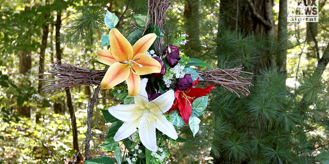 Flowers near the crime scene where Debbie Collier was found. 