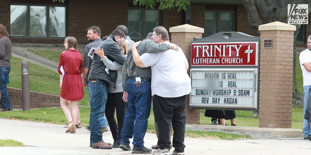 Family and friends of Cayler Ellingson attend his funeral at The Trinity Lutheran Church in Carrington, North Dakota on Monday, September 26, 2022. Over a hundred people packed the small church to pay their respects after Cayler was allegedly mowed down by an SUV during the early morning hours of September 18, 2022, following a street dance at a local bar in McHenry, North Dakota.