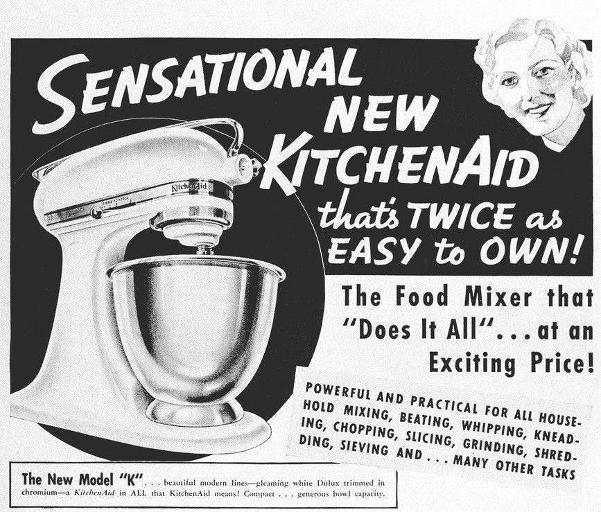 Image of an old advertisement for the Model K that reads: “Sensational new KitchenAid that’s twice as easy to own!”