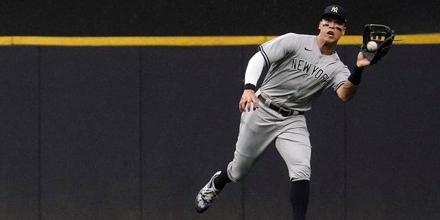 New York Yankees' Aaron Judge makes a catch on a ball hit by Milwaukee Brewers' Hunter Renfroe during the first inning of a baseball game Saturday, Sept. 17, 2022, in Milwaukee. 