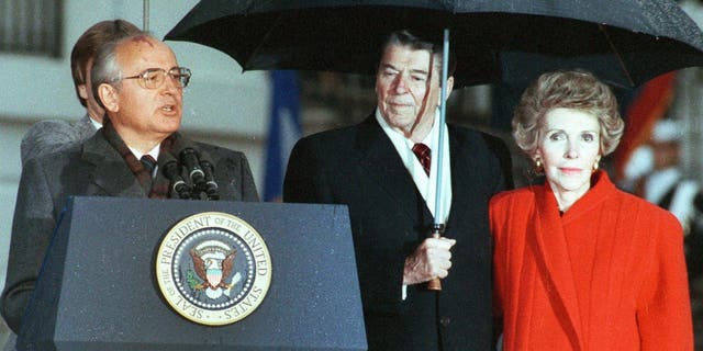 Former U.S. President Reagan and his wife Nancy listen to former Soviet leader Mikhail Gorbachev speak during Gorbachev's departure ceremony at the White House in Washington, D.C., Dec. 10, 1987.