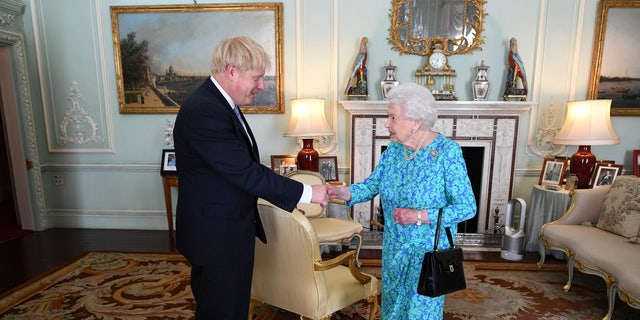 Queen Elizabeth II welcomes Boris Johnson during an audience in Buckingham Palace, where she will officially recognize him as the new prime minister in London July 24, 2019. 