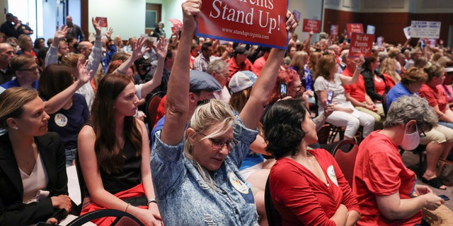 Parents and community members attend a Loudoun County School Board meeting about critical race theory in Ashburn, Virginia, on June 22, 2021.