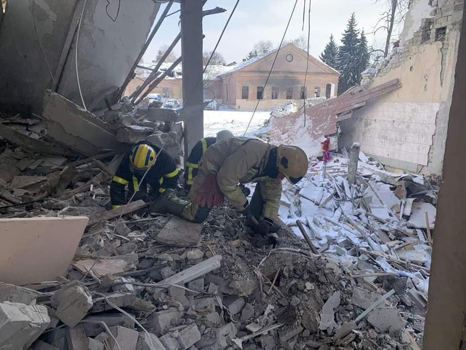 A worker digs through the rubble after Ukrainian forces recaptured the area.