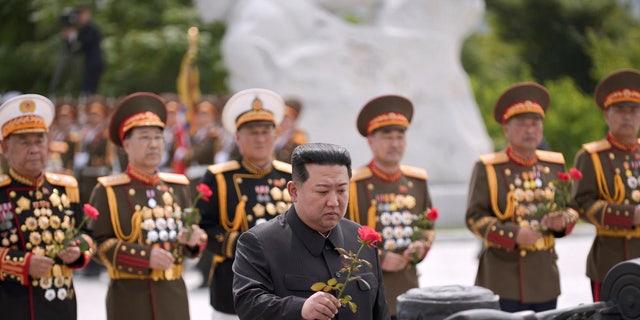 North Korea's leader Kim Jong Un places a flower to pay tribute to the North's soldiers killed in the Korean War and buried at the Fatherland Liberation War Martyrs Cemetery to mark the 69th anniversary of the Korean War armistice in Pyongyang, North Korea, in this photo released July 27, 2022.