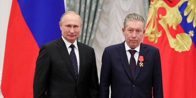 Russian President Vladimir Putin stands next to First Executive Vice President of oil producer Lukoil Ravil Maganov after decorating him with the Order of Alexander Nevsky during an awarding ceremony at the Kremlin in Moscow, Russia, November 21, 2019. 