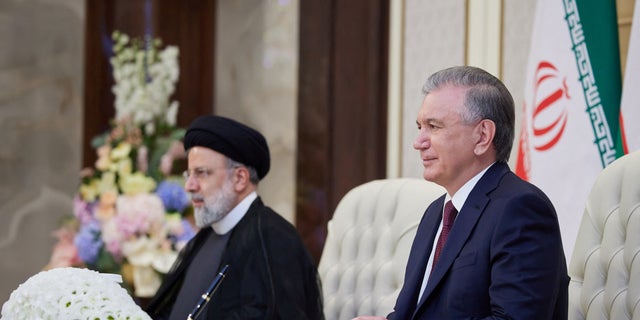 Uzbekistan President Shavkat Mirziyoyev, right, meets Iran's counterpart Ebrahim Raisi ahead of the Shanghai Cooperation Organization (SCO) summit in Samarkand, Uzbekistan, on Wednesday. 