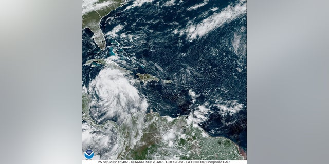 Tropical Storm Ian is seen near the coast of Cuba in this satellite image taken September 25, 2022. 