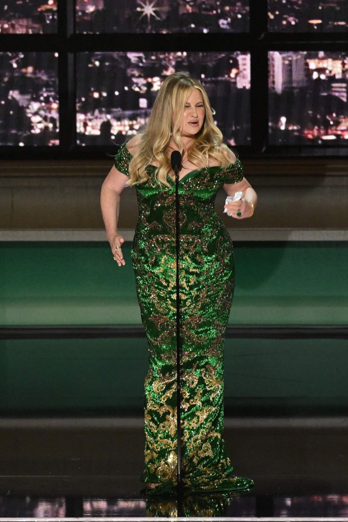 Jennifer Coolidge onstage with an Emmy. 