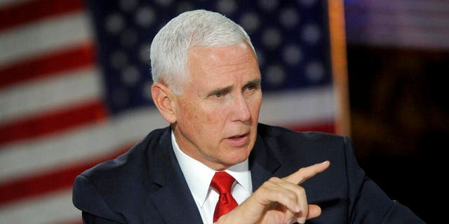 Vice President Mike Pence asks a question during the fifth National Space Council meeting held at the U.S. Space and Rocket Center Tuesday, March 26, 2019, in Huntsville, Ala. Pence is calling for landing astronauts on the moon within five years. (AP Photo/Eric Schultz)