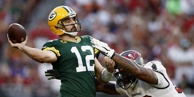 Aaron Rodgers of the Green Bay Packers throws a pass against the Tampa Bay Buccaneers during the fourth quarter at Raymond James Stadium in Tampa, Florida, on Sept. 25, 2022.