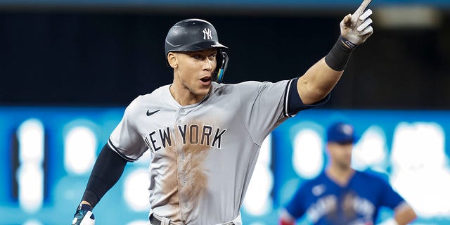 Aaron Judge, #99 of the New York Yankees, runs the bases as he hits his 61st home run of the season in the seventh inning against the Toronto Blue Jays at Rogers Centre on Sept. 28, 2022 in Toronto. Judge has now tied Roger Maris for the American League record. 