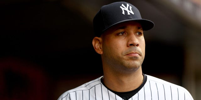 Marwin Gonzalez #14 of the New York Yankees walks out of the dugout before the game against the Cincinnati Reds at Yankee Stadium on July 14, 2022, in the Bronx borough of New York City.