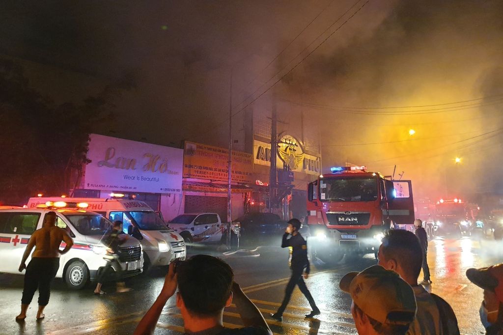 Firefighters are at the scene the day when the deadly fire broke out at the karaoke bar in Binh Duong province.