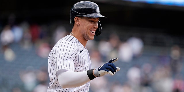 New York Yankees designated hitter Aaron Judge reacts after drawing a bases-loaded walk for the winning run against the Chicago White Sox May 23, 2021, at Yankee Stadium in New York. 