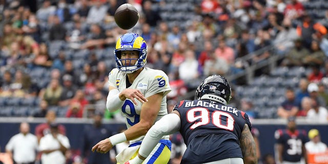 Los Angeles Rams quarterback Matthew Stafford throws under pressure from the Texans, Oct. 31, 2021, in Houston.