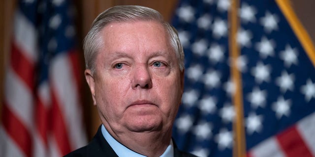 Sen. Lindsey Graham, R-S.C., the ranking member of the Senate Budget Committee, waits to speak to reporters following bi-partisan passage of the Ending Forced Arbitration of Sexual Assault and Sexual Harassment Act.