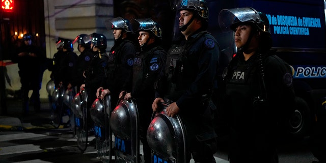 Police guard the scene where a man pointed a gun at Argentina's Vice President Cristina Fernandez during an event in front of her home in the Recoleta neighborhood of Buenos Aires, Argentina, Thursday, Sept. 1, 2022. 