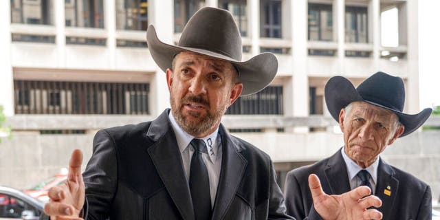 Otero County, New Mexico Commissioner Couy Griffin speaks to reporters as he arrives at federal court in Washington, Friday, June. 17, 2022.