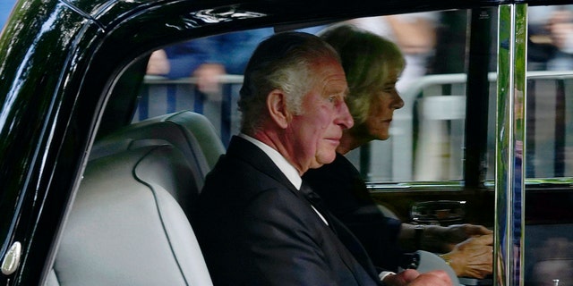 Britain's King Charles III and Camilla, the Queen Consort, arrive at Buckingham Palace after traveling from Balmoral Castle following the death of Queen Elizabeth II on Thursday, in London, on Friday, Sept. 9. 