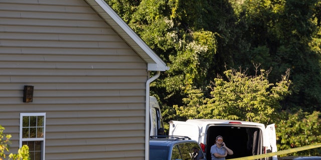 Law enforcement gather at the scene Friday, Sept. 9, 2022, in Elk Mills, Maryland. Five people were found dead inside a home in northeastern Maryland on Friday after deputies were called to investigate a report of a shooting.