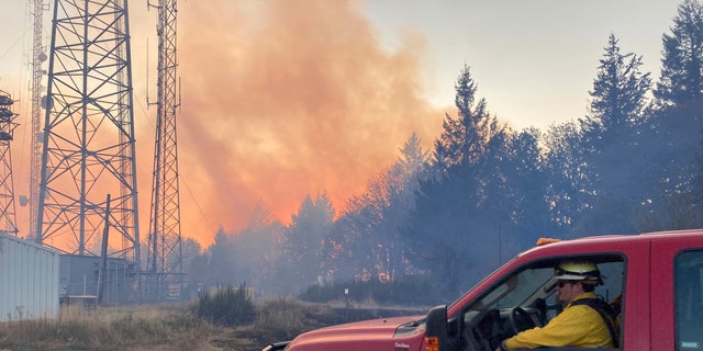 Firefighters use aircraft to battle a wildfire south of Salem, Ore., on Friday, Sept. 9, 2022. Climate change is bringing drier conditions to the Pacific Northwest and that requires strategies that have been common in fire-prone California for the past decade or more, said Erica Fleishman, director of the Oregon Climate Change Research Institute at Oregon State University.