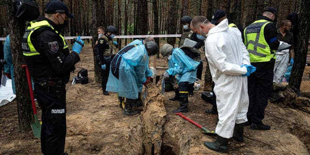  Ukrainian authorities discovered a mass burial site near the recaptured city of Izyum that contained hundreds of graves.