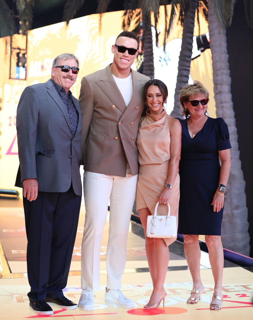 Aaron Judge poses with his wife and parents at the 2022 MLB All Star game in Los Angeles.