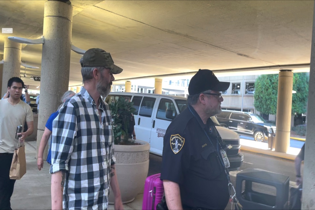 Andy Huynh, far left, and Alex Drueke, right, are seen leaving Birmingham-Shuttlesworth International Airpor