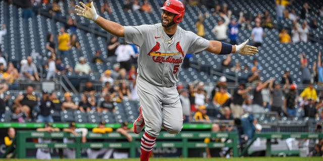 Albert Pujols #5 of the St. Louis Cardinals reacts as he runs the bases after hitting a two-run home run in the ninth inning during the game against the Pittsburgh Pirates at PNC Park on Sept. 11, 2022 in Pittsburgh, Pennsylvania.