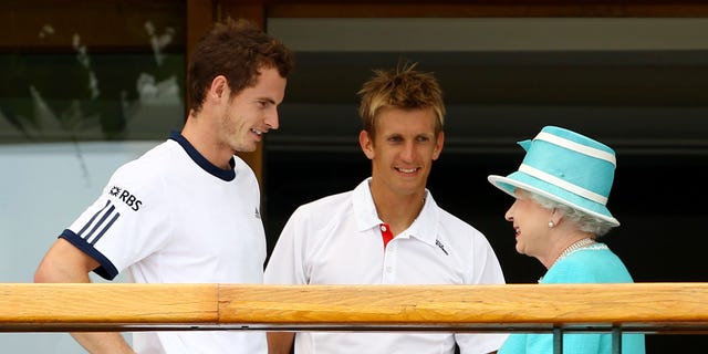 Andy Murray, left, of Great Britain and Jarkko Nieminen of Finland meet Queen Elizabeth II after their match at Wimbledon on June 24, 2010, in London.