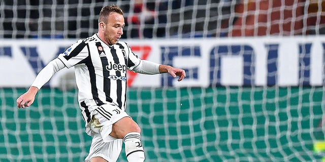 Arthur Melo of Juventus dribbles during the Serie A match between Genoa CFC and Juventus at Stadio Luigi Ferraris in Genoa, Italy, on April 30, 2022.