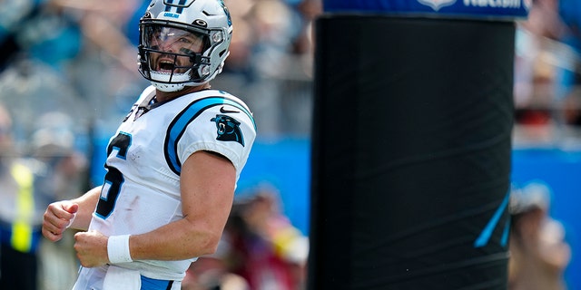 Carolina Panthers quarterback Baker Mayfield celebrates after scoring against the Cleveland Browns during the second half of an NFL football game on Sunday, Sept. 11, 2022, in Charlotte, North Carolina.