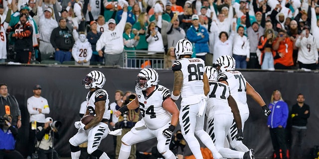 Cincinnati Bengals' Joe Mixon (28) celebrates a rushing touchdown against the Miami Dolphins during the first half, Thursday, Sept. 29, 2022, in Cincinnati.