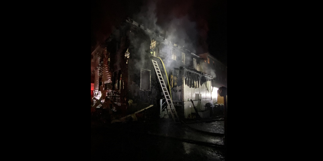 The aftermath of the fire in Roslindale, in Boston, Mass., early Saturday.