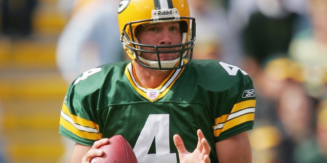 Quarterback Brett Favre of the Green Bay Packers attempts a pass against the New York Giants on Oct. 3, 2004, at Lambeau Field in Green Bay, Wisconsin.