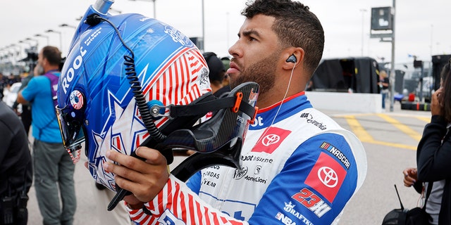 Bubba Wallace prepares for qualifying for the NASCAR Cup Series auto race at Kansas Speedway in Kansas City, Kan., Saturday, Sept. 10, 2022.