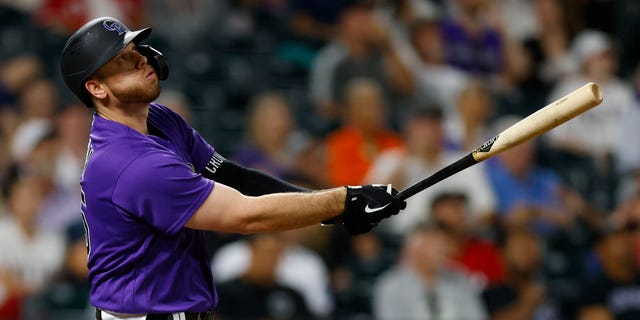 C.J. Cron of the Colorado Rockies watches his three-run home run in the seventh inning against the Texas Rangers at Coors Field Aug. 23, 2022, in Denver.