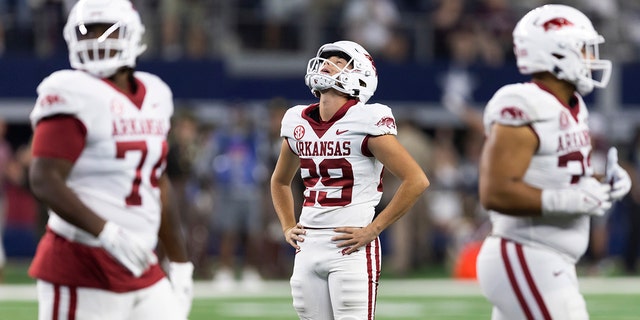 Razorbacks kicker Cam Little had a chance to win the game but his 42-yard field goal attempt from the left hashmark hit just off the top of the right upright.