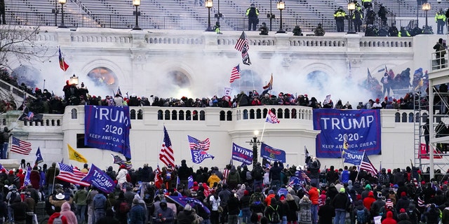 Lawmakers are seeking to pass legislation to prevent another attack on the Capitol like the one on January 6, 2021 by a mob of Trump supporters. (AP Photo/John Minchillo)