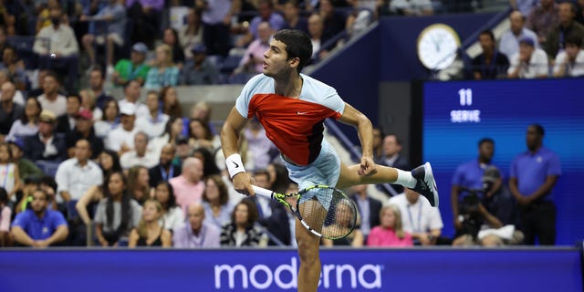 Carlos Alcaraz of Spain serves against Frances Tiafoe of the United States during their Men’s Singles Semifinal match on Day Twelve of the 2022 US Open at USTA Billie Jean King National Tennis Center on September 09, 2022 in the Flushing neighborhood of the Queens borough of New York City.