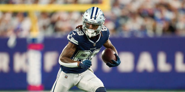 CeeDee Lamb #88 of the Dallas Cowboys runs with the ball after a catch against the New York Giants at MetLife Stadium on September 26, 2022 in East Rutherford, New Jersey.