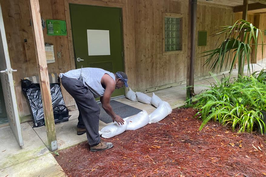 Sandbags being placed at the center to prevent flooding.