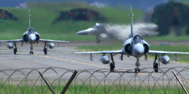 Taiwan Air Force Mirage fighter jets taxi on a runway at an airbase in Hsinchu, Taiwan, Friday, Aug. 5, 2022.