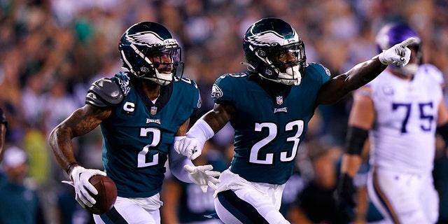 Philadelphia Eagles cornerback Darius Slay (2) celebrates with teammate safety C.J. Gardner-Johnson (23) after intercepting a pass during the second half of an NFL football game against the Minnesota Vikings, Monday, Sept. 19, 2022, in Philadelphia. 