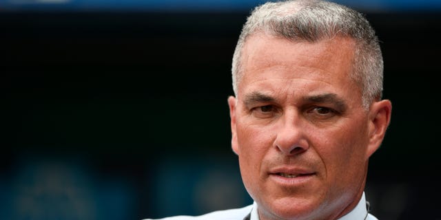 Dayton Moore general manager of the Kansas City Royals watches the batting practice prior to a game against the Cincinnati Reds at Kauffman Stadium on June 12, 2018 in Kansas City, Missouri. 