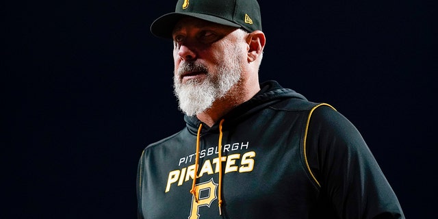 Pittsburgh Pirates manager Derek Shelton walks to the dugout after making a pitching change against the Reds on Tuesday, Sept. 13, 2022, in Cincinnati.