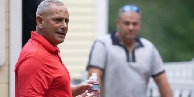 Retired Army Gen. Don Bolduc, who's making a second straight run for the GOP Senate nomination in New Hampshire, speaks with voters at a campaign event in Epping, N.H. on July 16, 2022